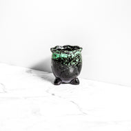 green and black handmade plant pot