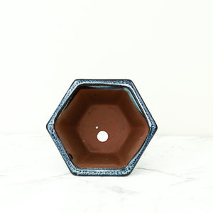 Top view of blue glazed hexagon plant pot